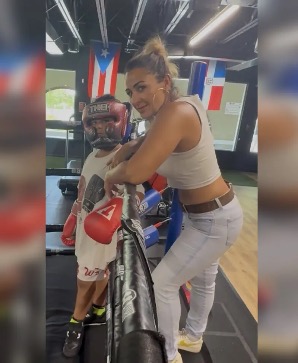 Leslie coaching her son in boxing